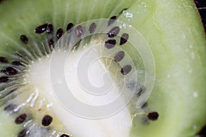 Kiwi fruit cutted. Healthy fruit kiwi cut for healthy fruit based nutrition. Green fruit with seeds, healthy and fresh diet for