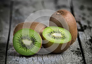 Kiwi fruit on old wooden