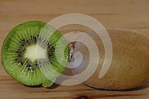 Kiwi fruit over wood background