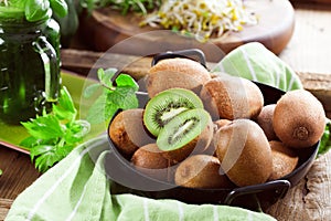 Kiwi fruit on wooden background with copy space