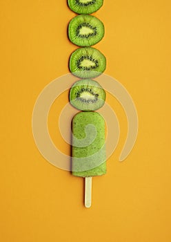 Kiwi ice cream popsicle. Green ice cream with kiwi slices