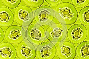 Kiwi slices illuminated from below Background Fruits Top view