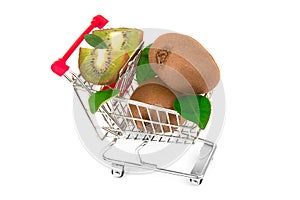 Kiwi with slices of kiwi and green leaves in metal trolley