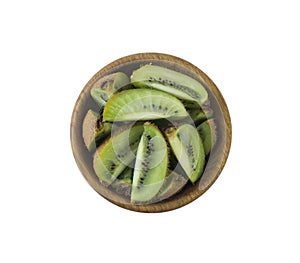 Kiwi slices in a wooden bowl with copy space for text. Ripe and tasty kiwi isolated on white.