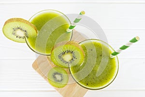 Kiwi yogurt smoothies juice and kiwi green fruit for breakfast in the morning on white background from top view