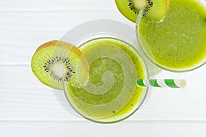 Kiwi yogurt smoothies juice and kiwi green fruit for breakfast in the morning on white background from top view