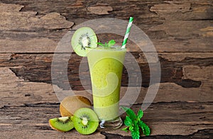 Kiwi yogurt smoothies juice and kiwi green fruit for breakfast in the morning on wood background.