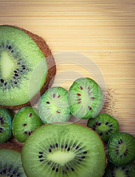 Kiwifruit and Kiwi berries with copy space