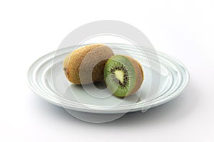 kiwifruit on plate isolated on white background