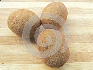 Kiwis on wooden background