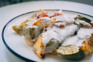 Kizartma, Turkish kitchen food, fried vegetables with yoghurt.