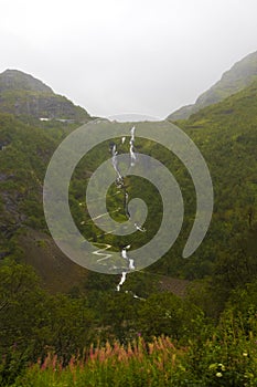 Kjosfossen Falls rainy summer day view Norway