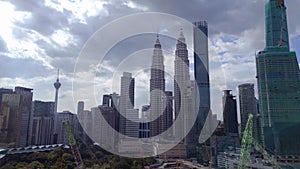 KL City petronas twin towers Skyscraper day. Magic aerial top view flight drone