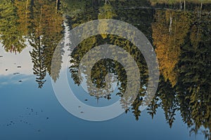 Kladska pond with rebound in water in autumn morning