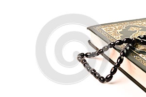 Klang, April 16, 2021-The holy book koran or quran and prayer beads isolated on a white background with copy space