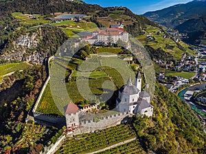 Klausen, Italy - Aerial view of the SÃÂ¤ben Abbey Monastero di Sabiona with Chiusa Klausen comune northeast of a city of Bolzano photo