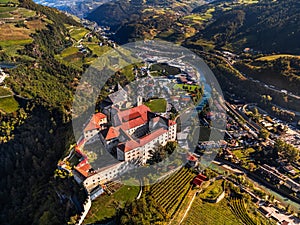Klausen, Italy - Aerial view of the Säben Abbey Monastero di Sabiona with Chiusa Klausen comune in South Tyrol Dolomites