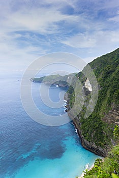 Klingung beach  with sky blue ocean water and  rocky bay and blue sky apart of one day traval trip of the eastern in Nusa Penida