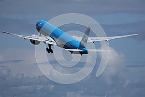 KLM plane approaching runway, cloudy