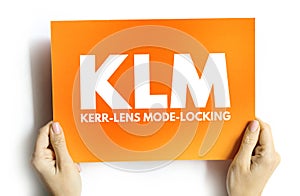 KLM - Kerr lens mode locking acronym on card, abbreviation concept background