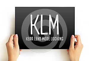 KLM - Kerr lens mode locking acronym text on card, abbreviation concept background