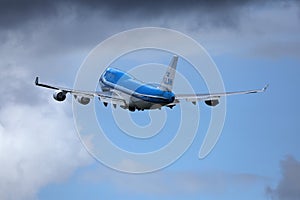 KLM plane took off from Amsterdam Airport Schiphol AMS, cloudy