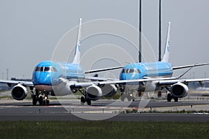 KLM planes lining up on Amsterdam Schiphol Airport AMS