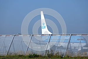 KLM Royal Dutch Airlines jet doing taxi in Schiphol Airport, Amsterdam. Tail closeup