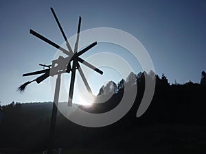 Klopotec bird scarer in austrian vineyard at sunset, southern st