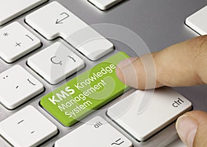 KMS Knowledge Management System - Inscription on Green Keyboard Key photo