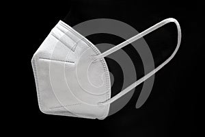 KN95 Face mask isolated on black background