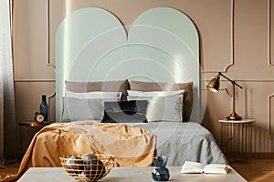 knacks on console table in from of king size bed with comfortable bedding