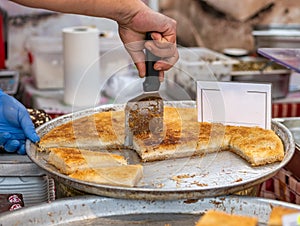 Knafeh or Kataif traditional Middle Eastern desert on a tray