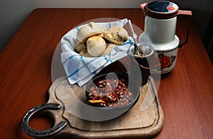 knead bread and pebre sauce with yerba mate tea photo