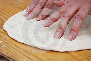 Knead and streach pizza