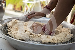 Kneading indian naan bread dough photo