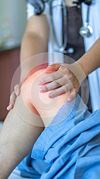 Knee injury and joint pain in elderly patient under doctor surgical medical exam, physiotherapy and treatment from osteoporosis
