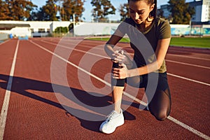 Knee injury in training.Girl injured his leg during exercise.