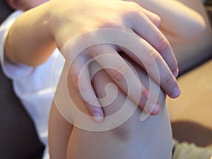 knee pain and bruise close-up.