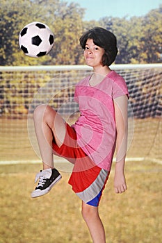 Kneeing the Soccer Ball photo