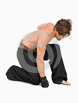 Kneeling martial arts fighter