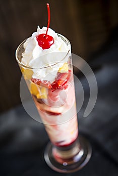 Knickerbocker glory Ice cream sundae with fruit and whipped cream