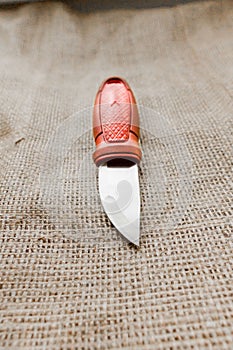 Knife on a background sacking.