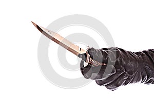 Knife in black glove isolated