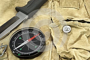 Knife and Compass on the Camouflage Bag