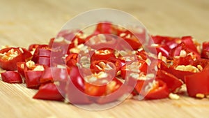 Knife Cut Chilli Pepper on Wooden Cutting Board. Hot Spicy Food concept