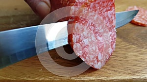 The knife cuts salami sausage ingredient spanish homemade gourmet