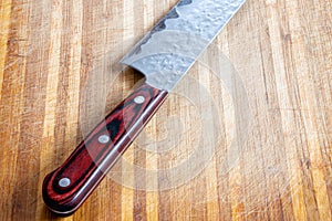 A knife on a cutting board. Wooden cutting board.Cooking