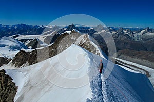 Knife edge snow and rock mountain ridge