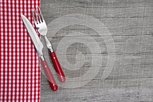 Knife and fork - bavarian country style table decoration on a wooden background
